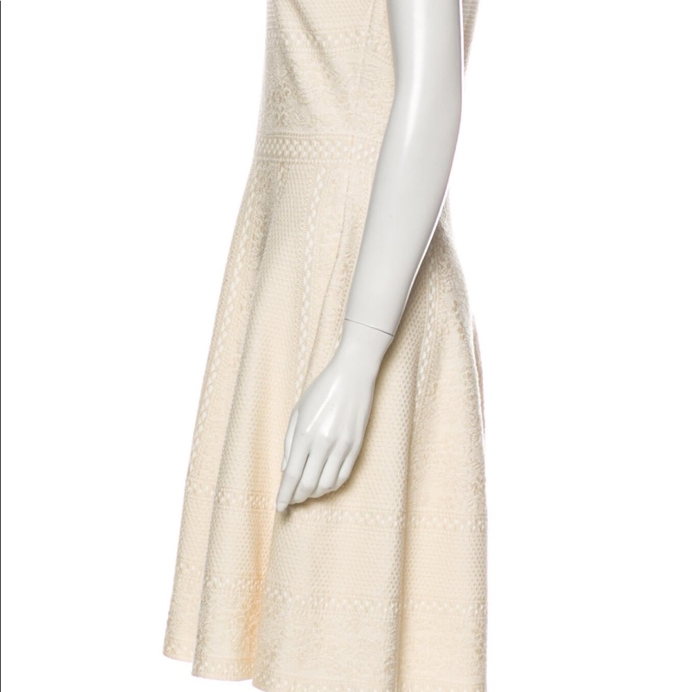 A neutral color dress fits true to size.